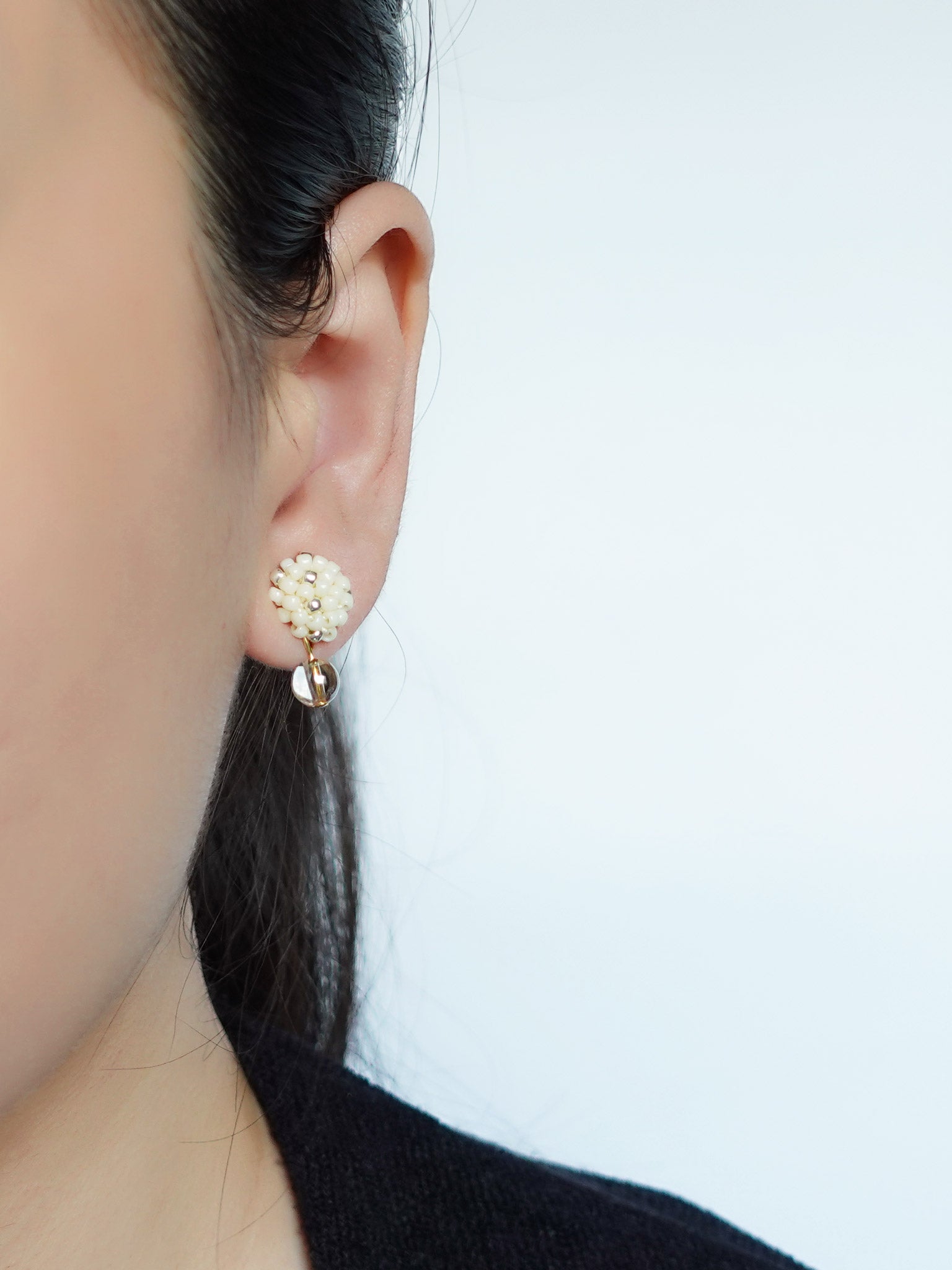 Layna Globe Earrings in Milk White Model