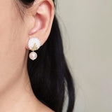 Mariota Two Ninths Earrings in White Model