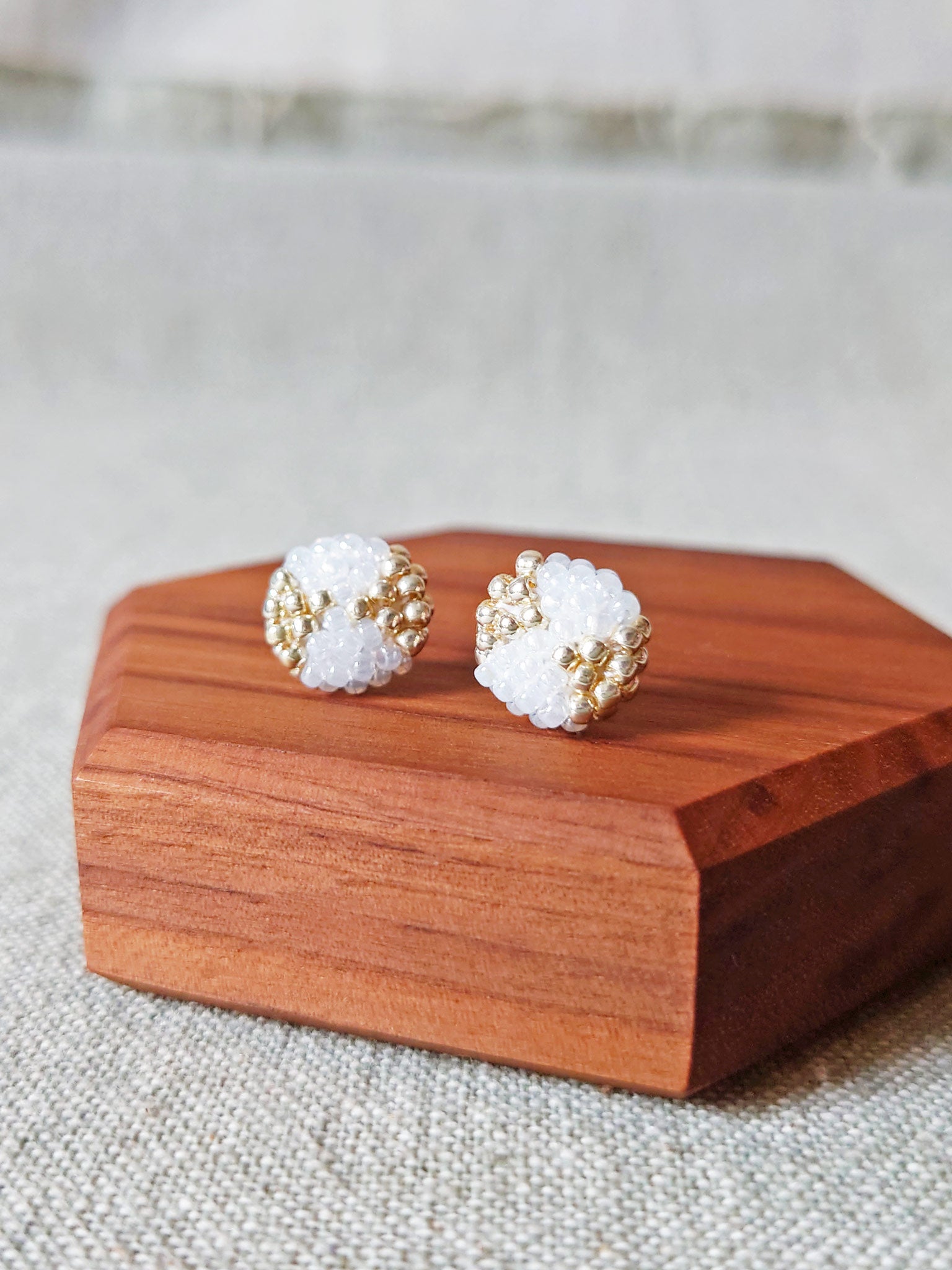 Octavia Stud Earrings in White Display Front 1