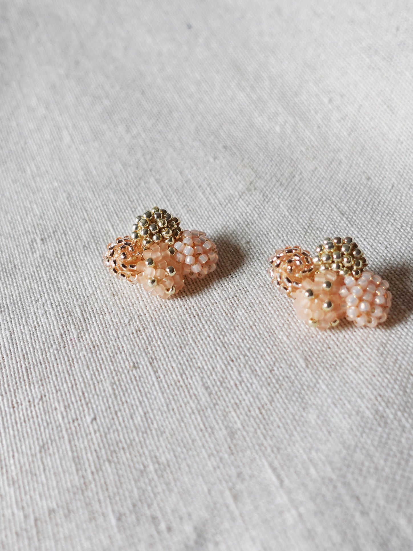 Orion X Earrings in Peach Left