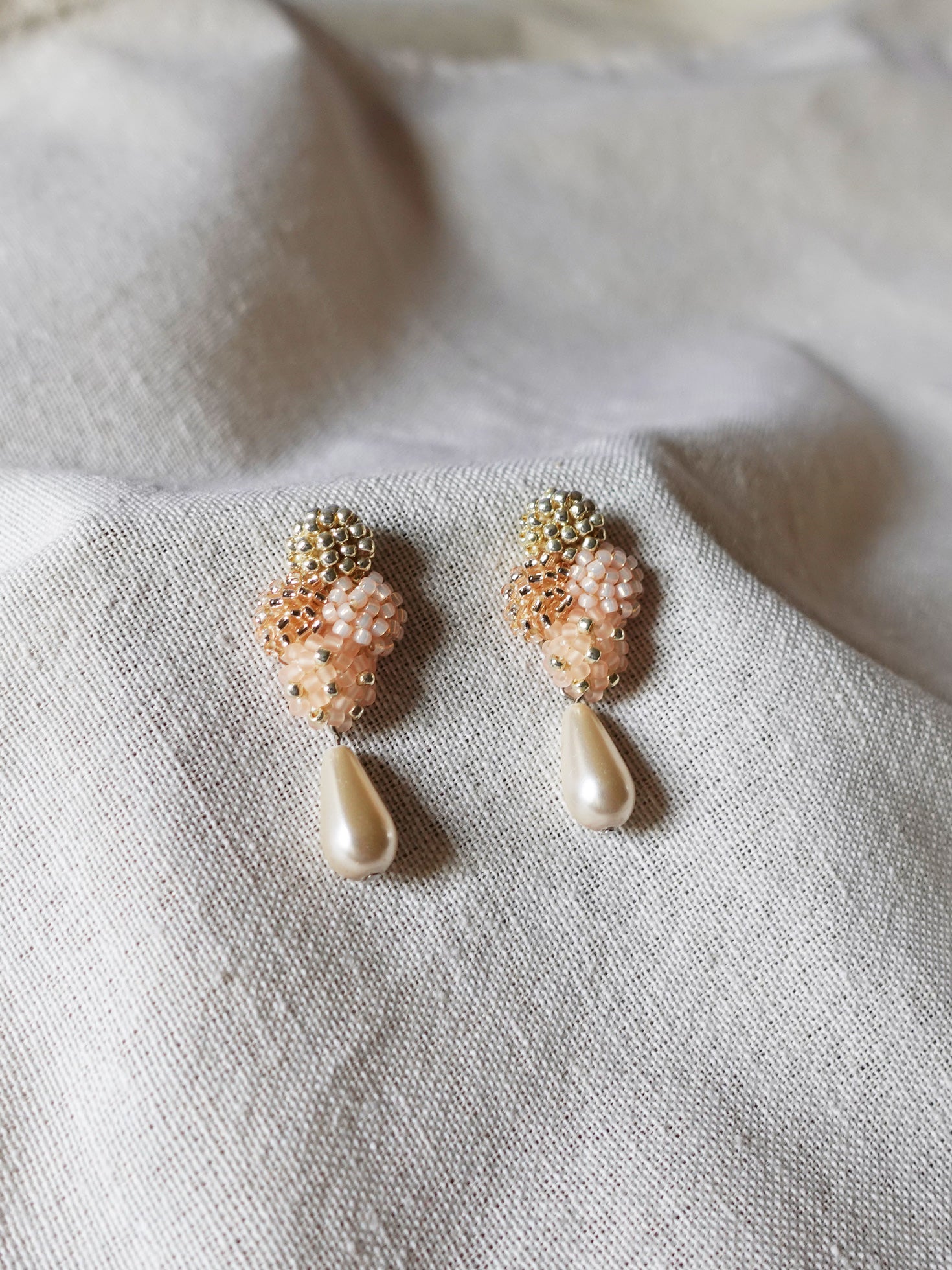 Orion Y Teardrop Earrings in Peach Front