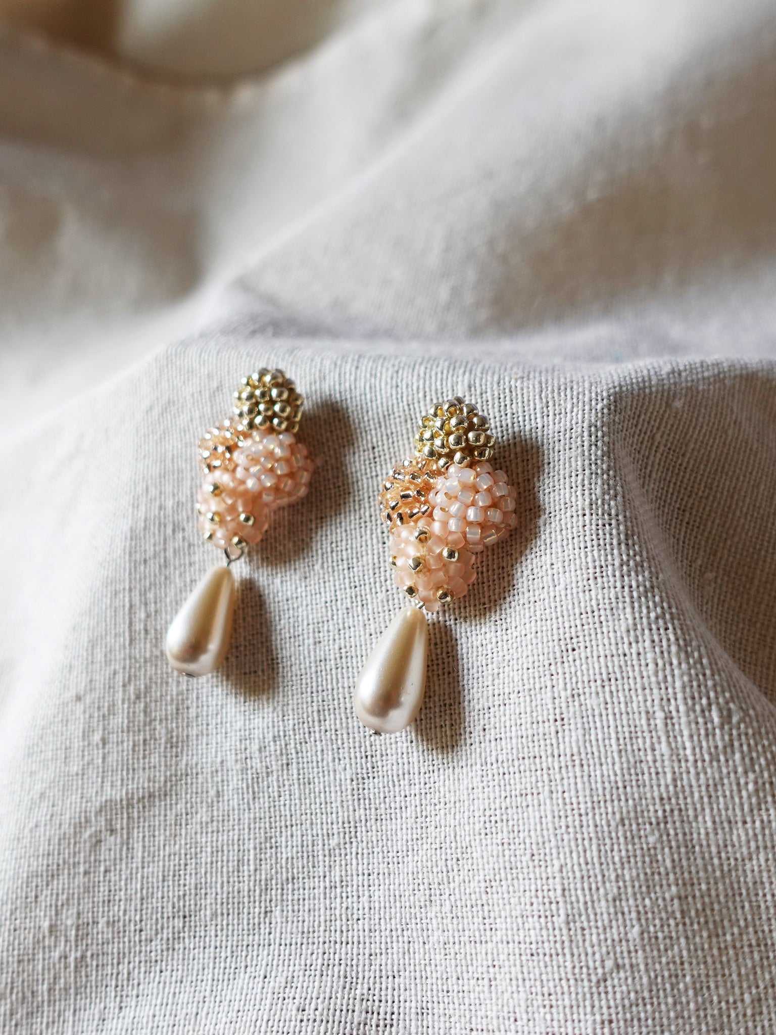 Orion Y Teardrop Earrings in Peach Right