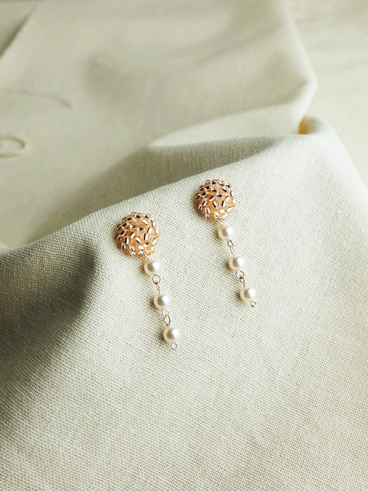 Raindrops on the Window Earrings in Champagne Pink Left