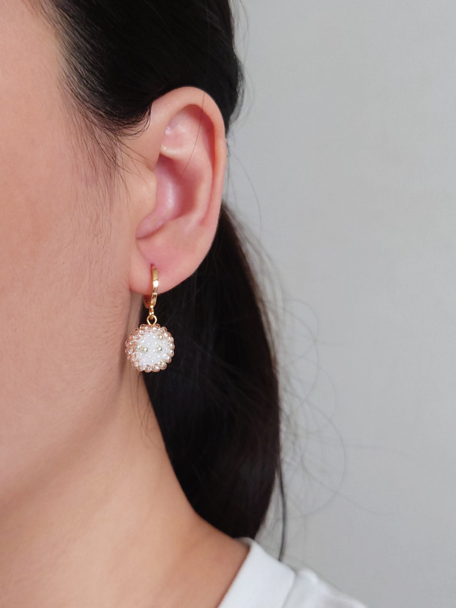 Rio Pendant Earrings in Champagne Pink Model