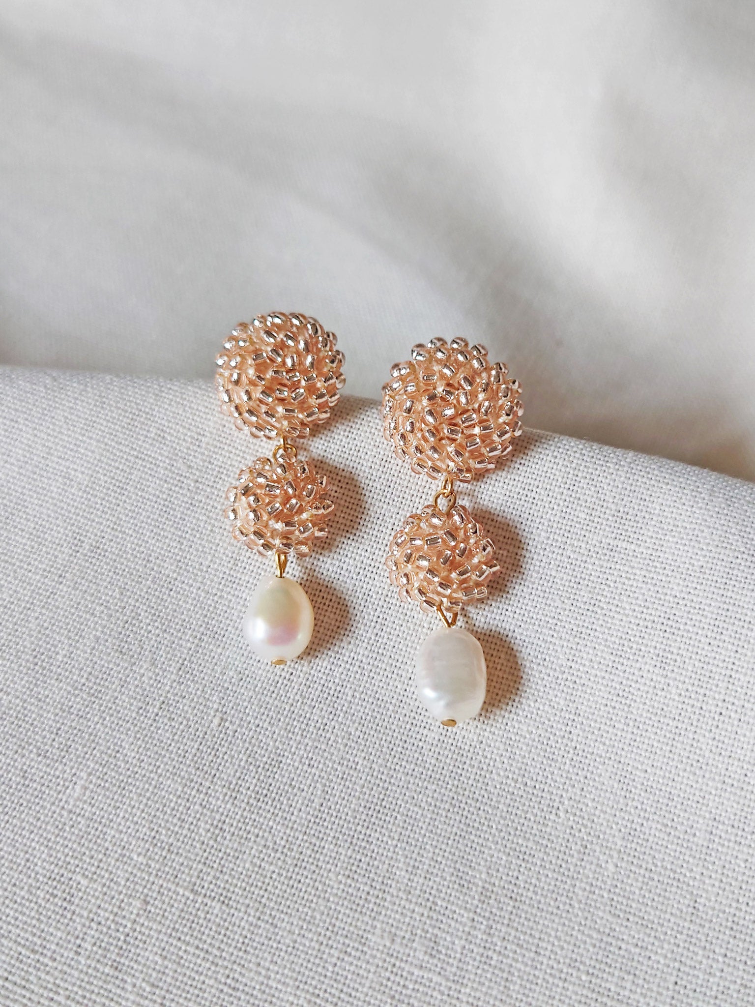 Soleil Dangle Earrings in Champagne Pink Front
