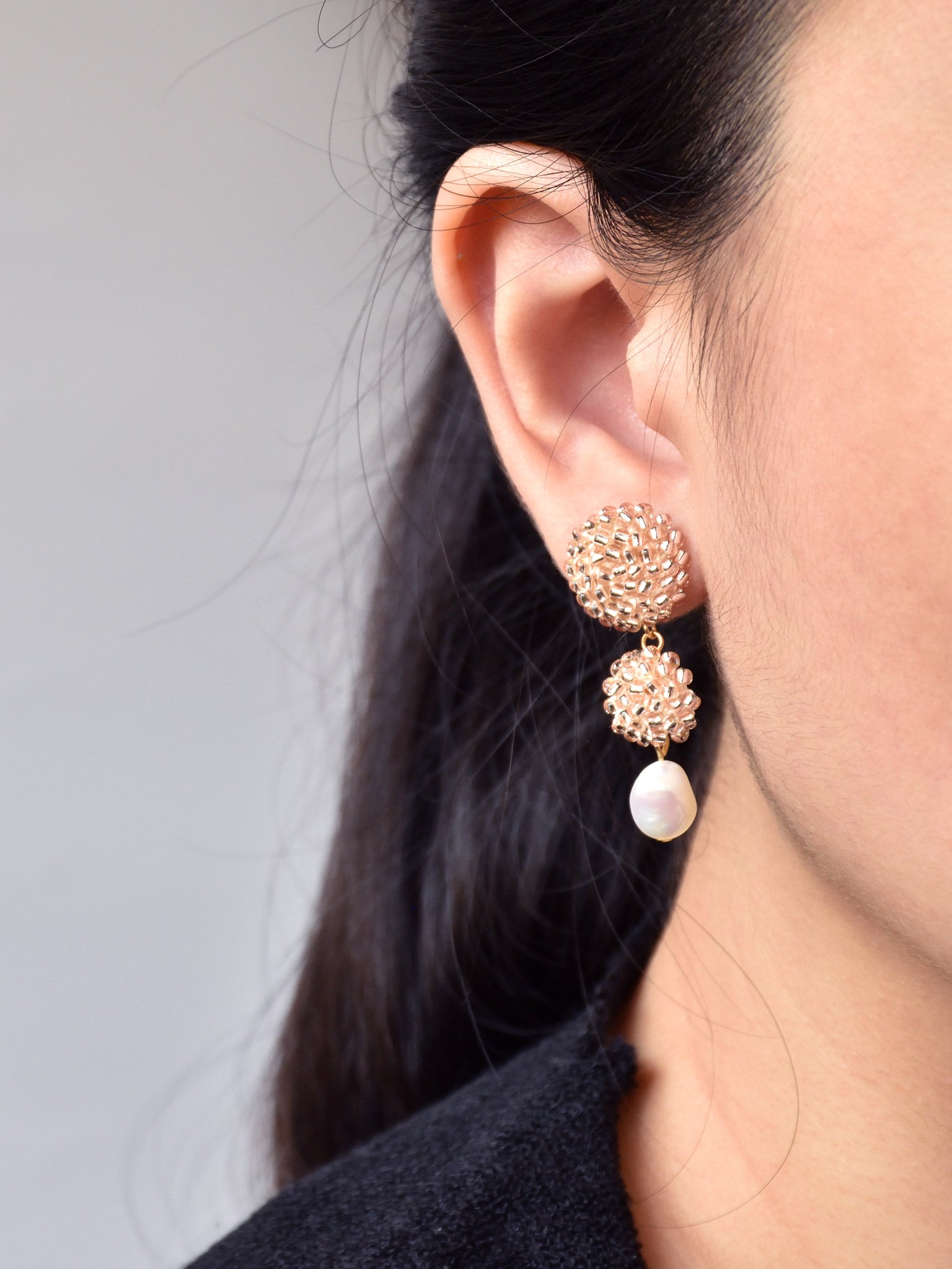 Soleil Dangle Earrings in Champagne Pink Model