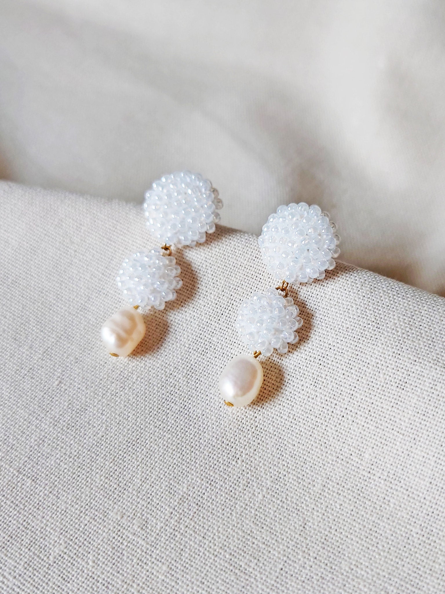 Soleil Dangle Earrings in White Front