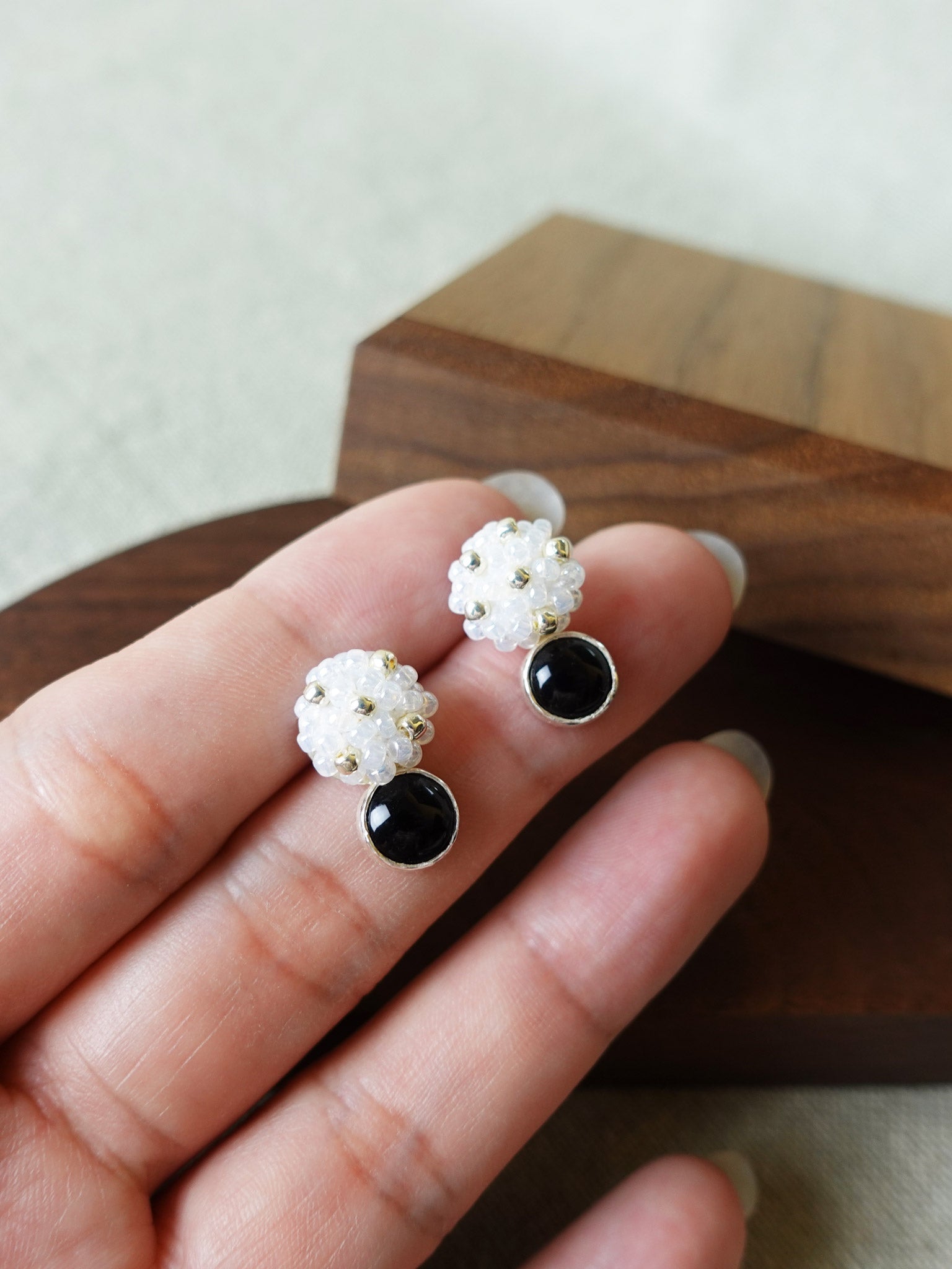 Star Dust Onyx Earrings Held