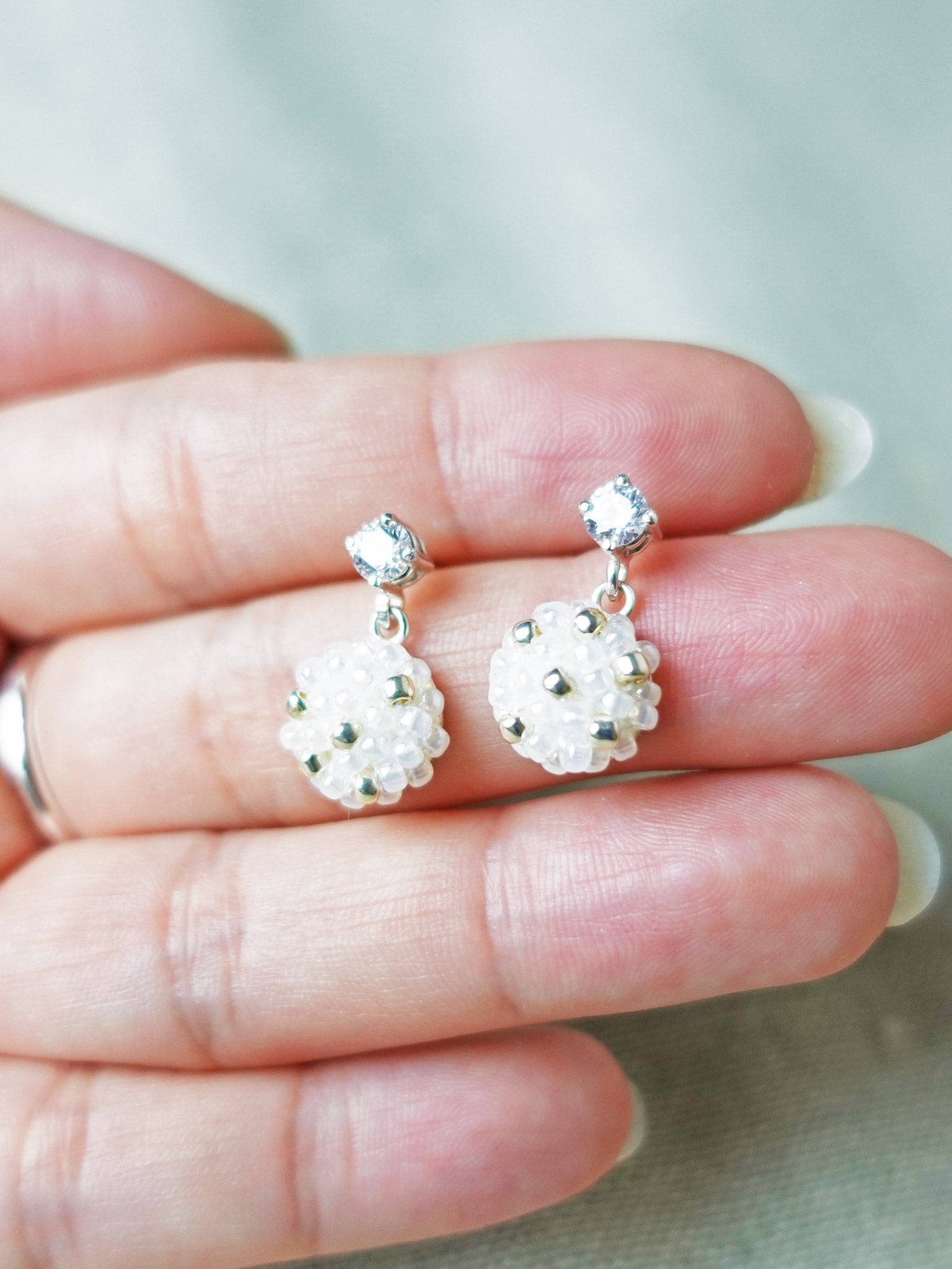 Star Dust Petite CZ Drop Earrings Hand