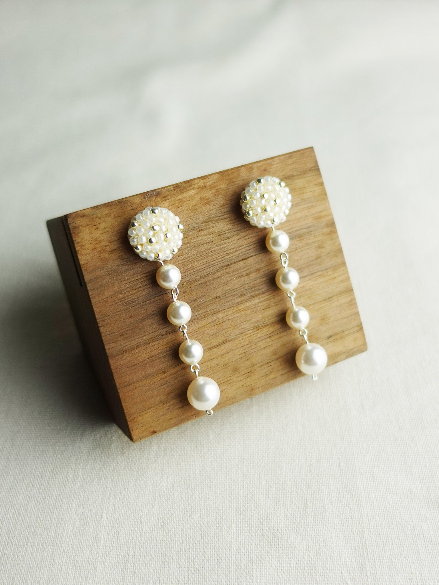 Thea Star Dust Earrings in Ivory Display