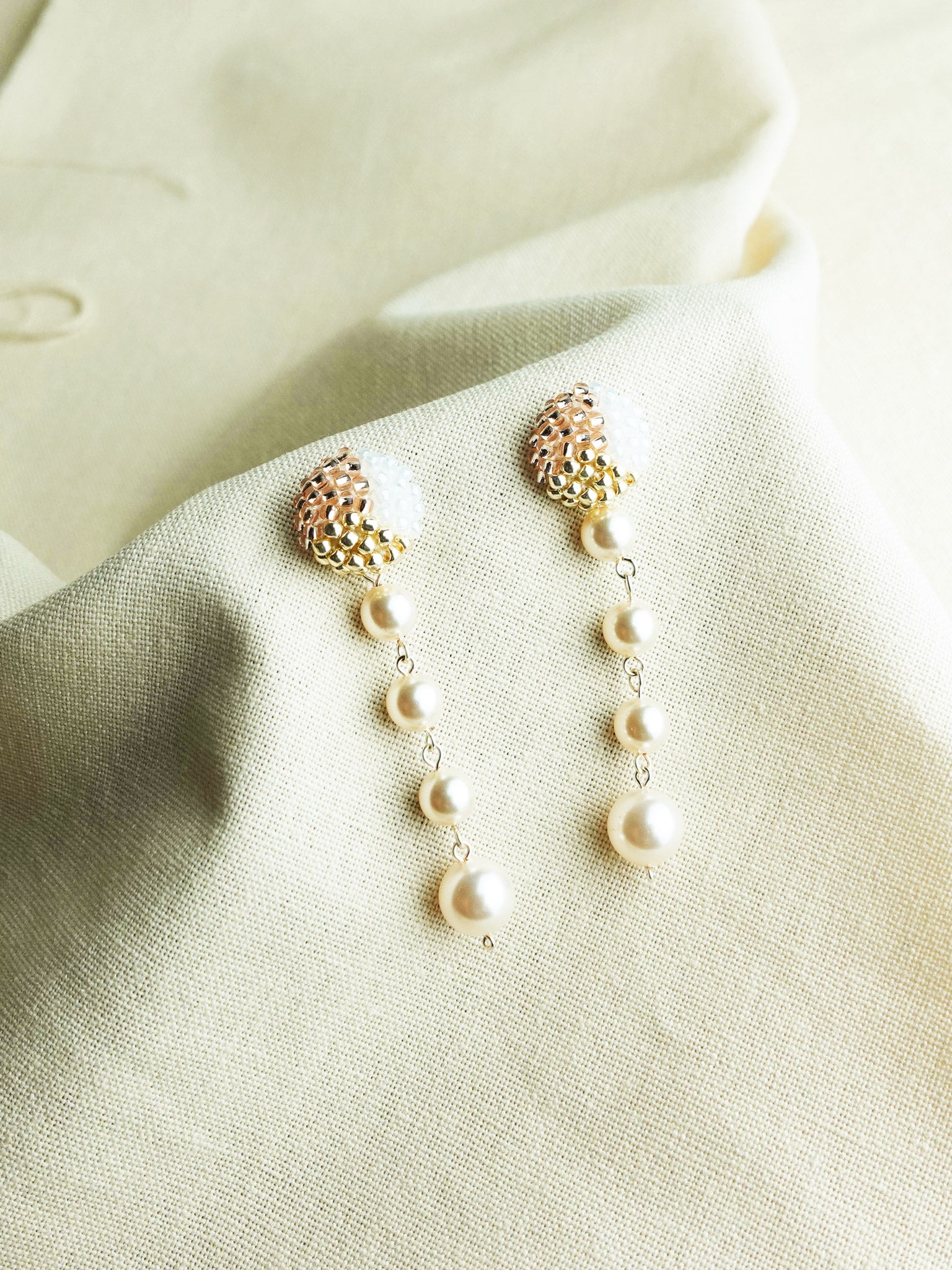Thea Trio Earrings in Champagne Pink Left