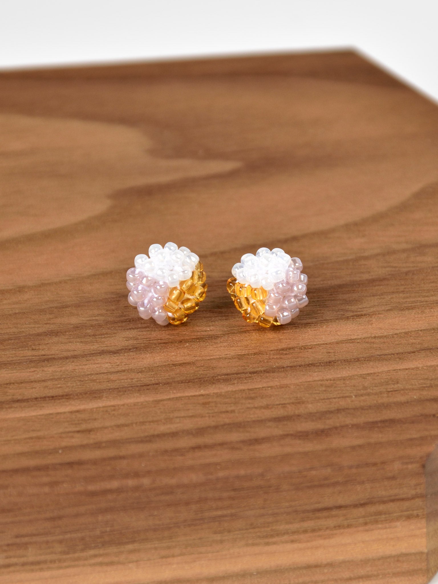 Trio Stud Earrings in Purple and Topaz Wood Display
